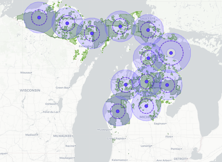 Map of Michigan with twelve airship coverage circles over the state's forests
